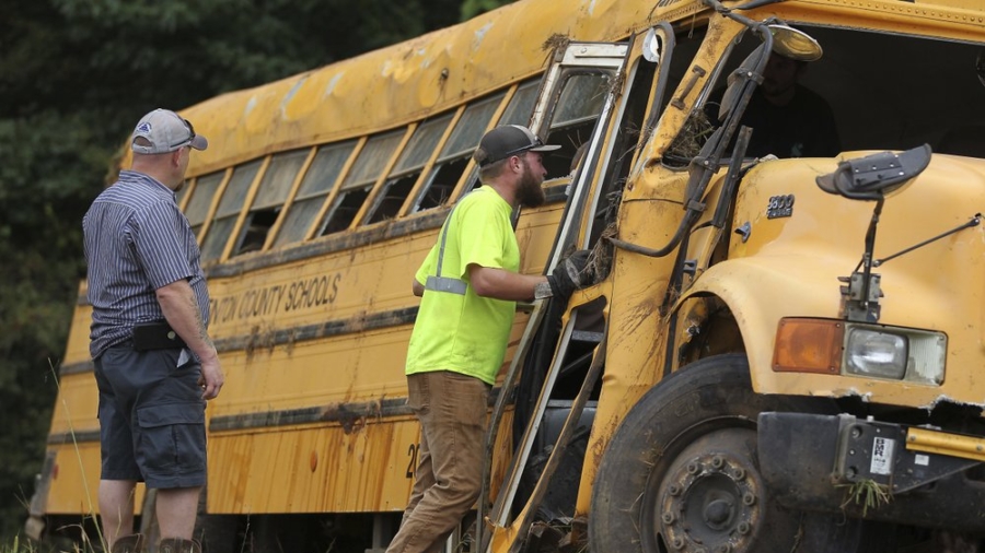 Driver Dies and 8 Children Are Injured as School Bus Crashes