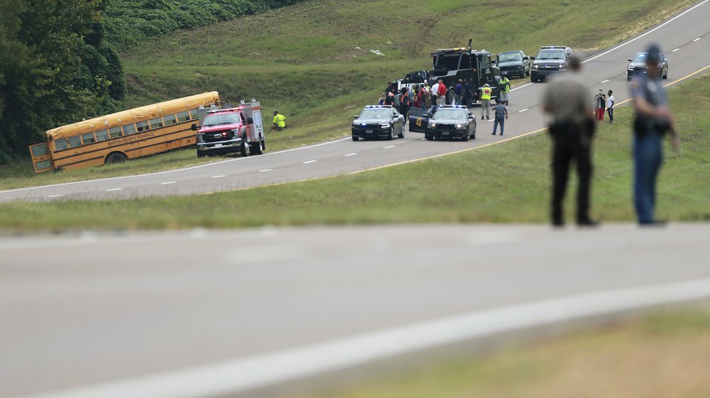 The Mississippi Highway Patrol shuts down a portion of U.S. Highway 72 westbound near Walnut, Miss., following a Benton County School bus accident where the driver was killed and several students were injured on Sept. 10, 2019. (Thomas Wells/The Northeast Mississippi Daily Journal via AP)