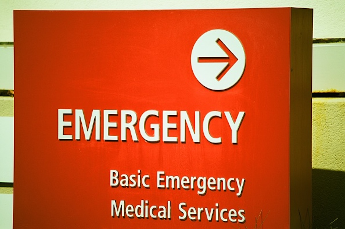 Close-up of bright red sign indicating the location of a hospital emergency room, Concord, Calif., on Sept. 8, 2017. (Smith Collection/Gado/Getty Images)