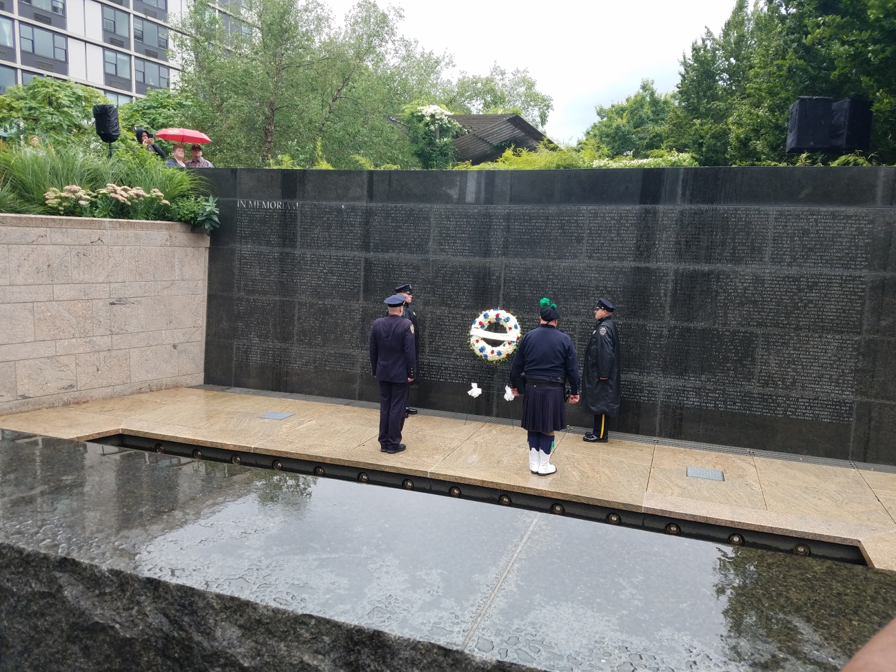 NYPD officers pay respects to fallen members of the force at the Memorial Wall in New York on Sept. 6, 2019. (Miguel Moreno/NTD News)