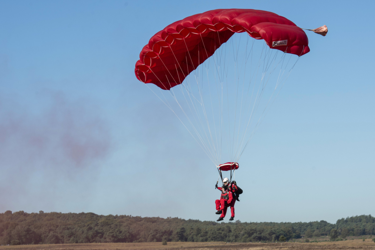 Sandy Cortmann, a 97-year-old British veteran who served during the Battle of Arnhem in the Second World War, has safely parachuted into the Netherlands to join commemorations for the 75th anniversary in Arnhem, Netherlands, on Sept. 21, 2019. (Cpl Robert Weideman/MOD via AP)