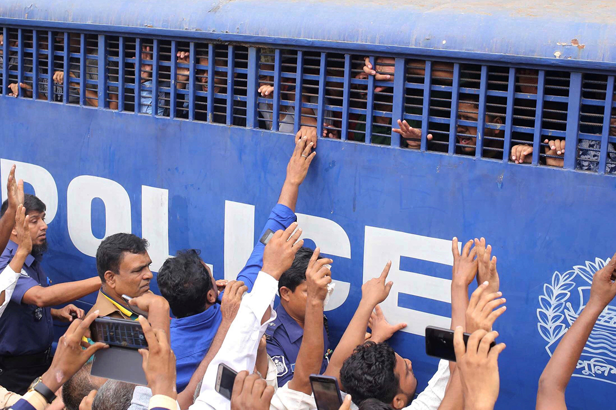 Accused people are seen inside a prison van after they were given death sentences in a murder case in Feni, Bangladesh, Oct. 24, 2019. (Reuters/Stringer)