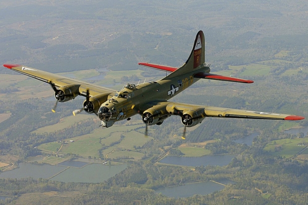 The Nine-O-Nine, a Collings Foundation B-17 Flying Fortress, flies over Thomasville, Ala., during its journey from Decatur, Ala., to Mobile, Ala., on April 2, 2002. (John David Mercer/Press-Register via AP)
