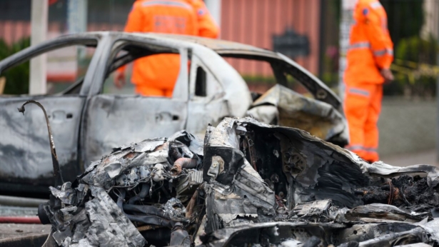 A wrecked car is seen at the site where a small plane crashed on a residential street in Belo Horizonte, Brazil, on Oct. 21, 2019. (Cristiane Mattos/Reuters)