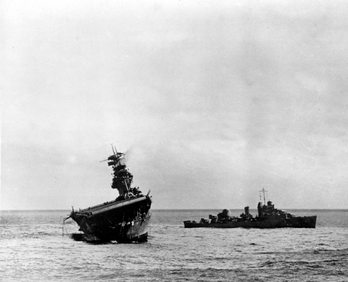 The USS Yorktown listing heavily to port after being struck by Japanese bombers and torpedo planes in the Battle of Midway on June 4, 1942. (U.S. Navy/AP Photo