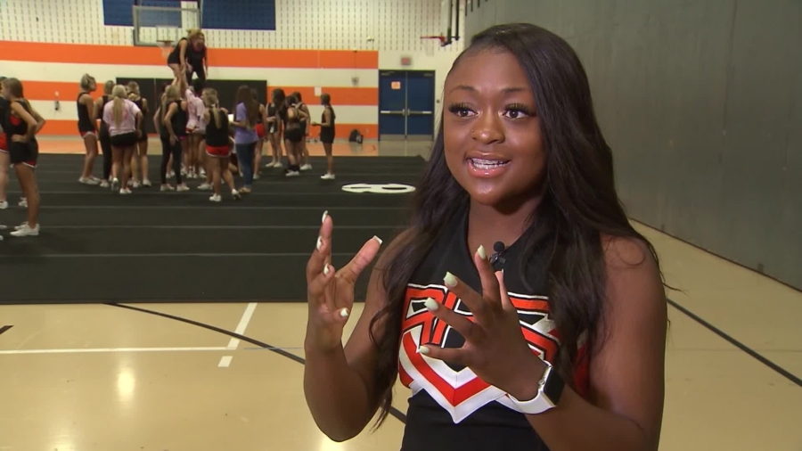 High School Cheerleader Jumps Off Float and Saves Choking Toddler