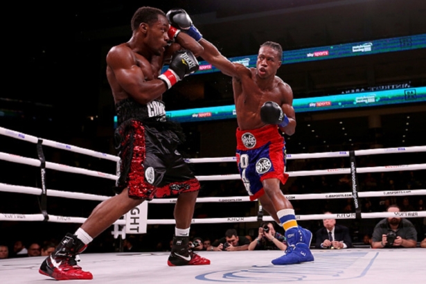 Patrick Day (R) lands a punch on Charles Conwell in the third round of their Super-Welterweight 