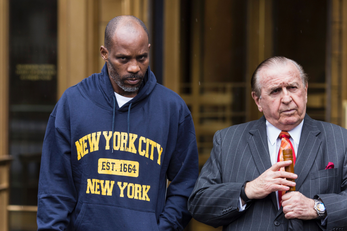 Hip-hop recording artist Earl Simmons, aka DMX, leaves the U.S. District Court with his attorney Murray Richman (R) after being arraigned, July 14, 2017, in New York City. (Photo by Dominick Reuter/AFP/Getty Images)