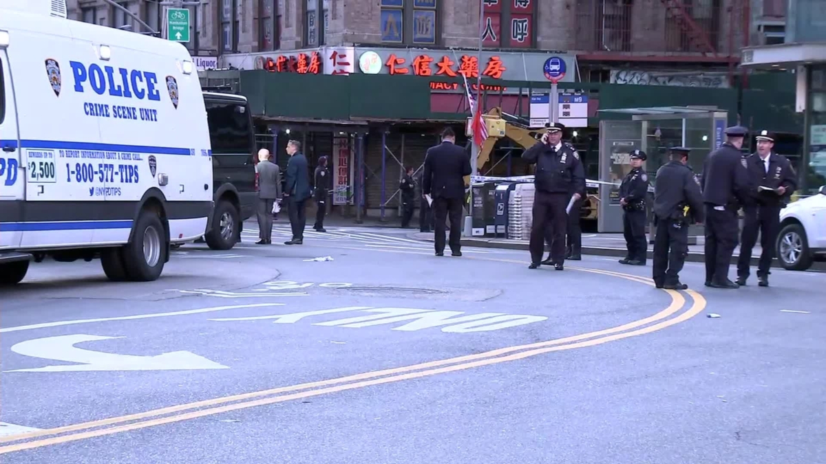 Police gather in Manhattan's Chinatown neighborhood on the morning of Oct. 5 after attacks in the borough on five men who are believed to have been homeless. (Photo courtesy of WABC)