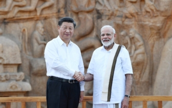 China’s Xi Lands in India Amid Scattered Tibetan Protests