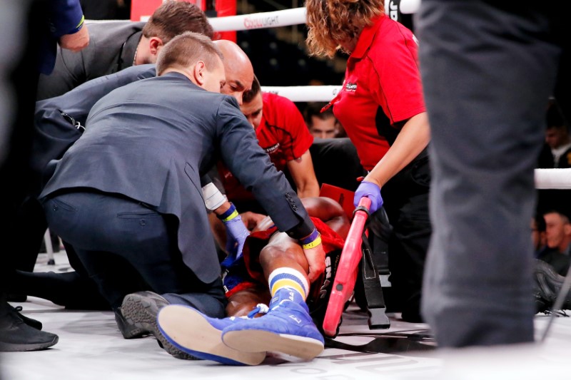 Patrick Day (red trunks) is tended to by paramedics after being knocked out by Charles Conwell (not pictured) during a USBA Super-Welterweight boxing match at Wintrust Arena in Chicago, Illinois, on Oct 12, 2019. (Jon Durr-USA TODAY Sports)