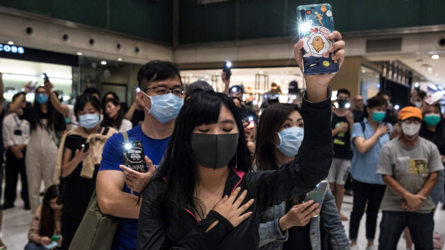 Protesters Defy Face Mask Ban; Petrol Bombs Thrown in Hong Kong Metro