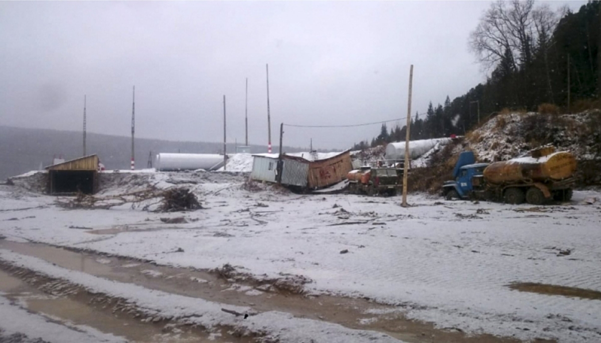 In this image made from video provided by Russian Emergency Situations Ministry press service, a view after the collapse during heavy rain occurred near the village of Shchetinkino, in the Krasnoyarsk region about 3,400 kilometers (2,100 miles) east of Moscow, Russia on Oct. 19, 2019. (Russian Ministry of Emergency Situations press service via AP)