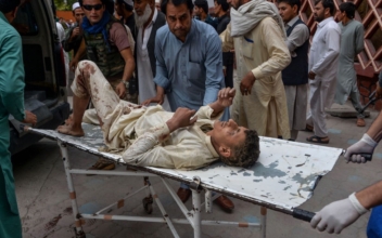 Afghans Search for Bodies After at Least 69 Killed in Mosque Explosions