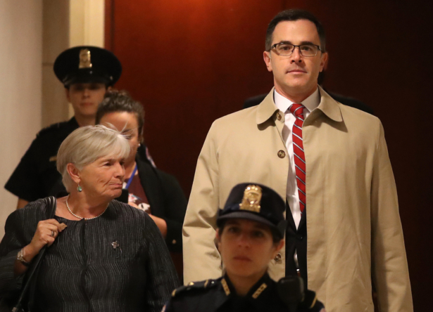 Timothy Morrison (R), National Security Council’s Russia and Europe Director, is escorted to a closed-door deposition in Washington on Oct. 31, 2019. (Mark Wilson/Getty Images)