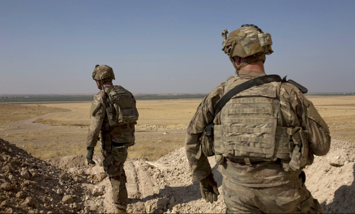 U.S. soldiers survey the safe zone between Syria and the Turkish border near Tal Abyad, Syria, on a joint patrol with the Tax Abyad Military Council, affiliated with the U.S.-backed Syrian Democratic Forces on Sept. 6, 2019. (Maya Alleruzzo/AP Photo)