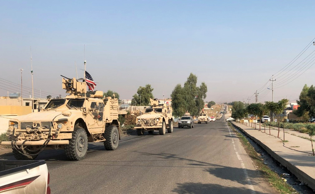 A convoy of U.S. vehicles is seen after withdrawing from northern Syria, at the Iraqi-Syrian border crossing in the Sahela border in the northern province of Dohuk, Iraq, on Oct. 21, 2019. (Kawa Omar/Reuters)