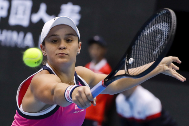 Ashleigh Barty of Australia hits a backhand shot against Petra Kvitova of the Czech Republic during their women's singles quarterfinal match in the China Open tennis tournament at the Diamond Court in Beijing, on Oct. 4, 2019. (Mark Schiefelbein/AP)