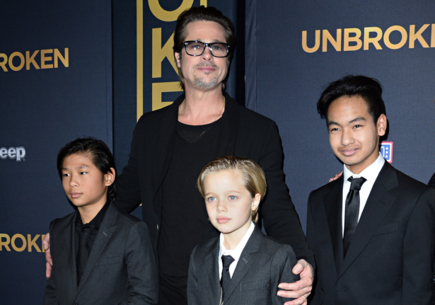 Actor Brad Pitt and children Pax Jolie-Pitt (L), Shiloh Jolie-Pitt (C) and Maddox Jolie-Pitt arrive for the U.S. premiere of "Unbroken," at the Dolby Theatre in Hollywood, Calif., on Dec. 15, 2014. (Robyn Beck/AFP/Getty Images)