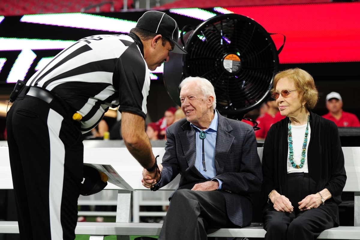 Former president Jimmy Carter (C) and his wife Rosalynn prior to the game between the Atlanta Falcons and the Cincinnati Bengals at Mercedes-Benz Stadium in Atlanta, Ga., on Sept. 30, 2018. (Scott Cunningham/Getty Images)
