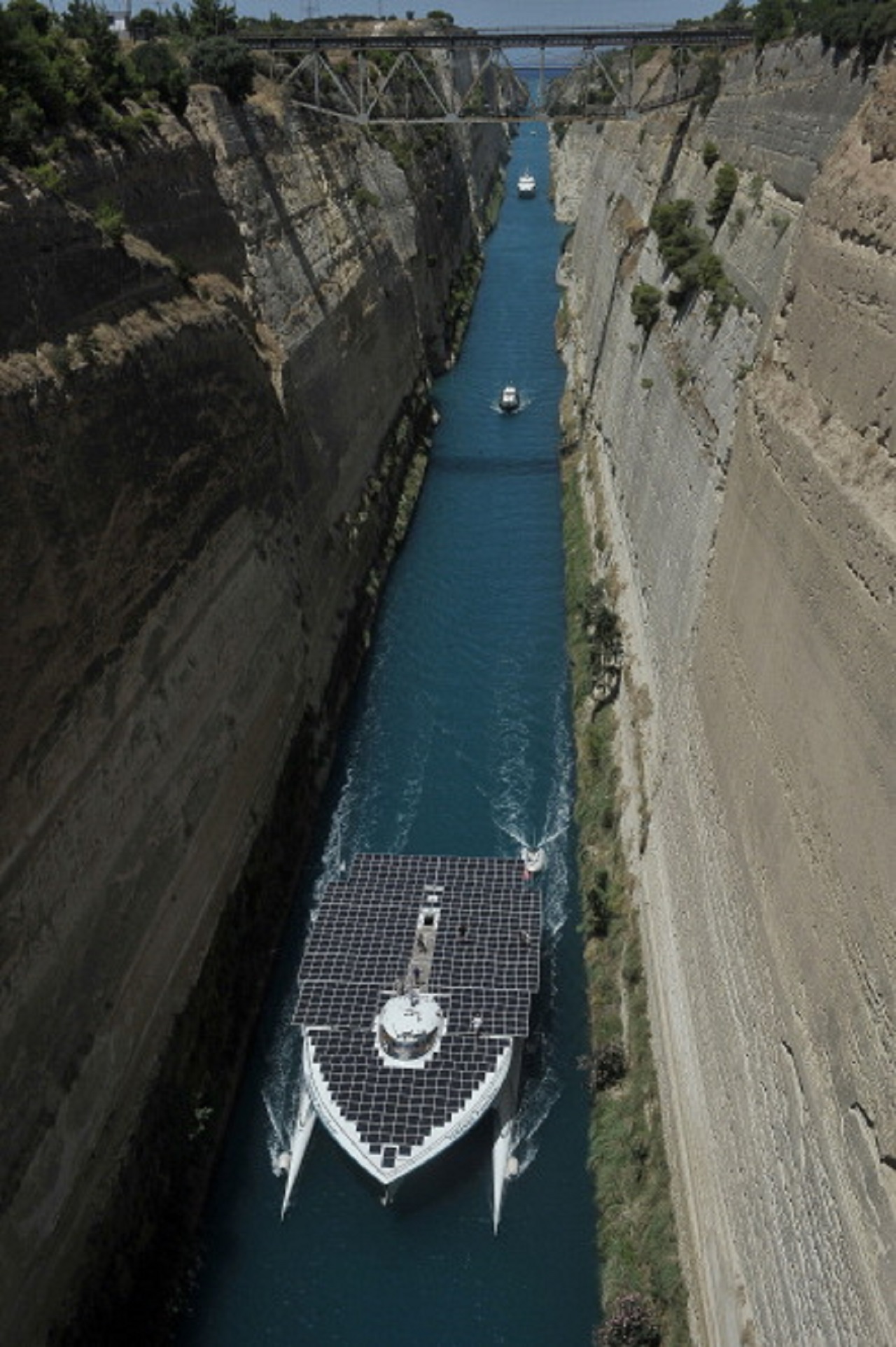 The world's largest solar-powered boat, "MS Turanor PlanetSolar" sails through the Corinth Canal near the town of Corinth on July 28, 2014. (VALERIE GACHE/AFP/Getty Images)