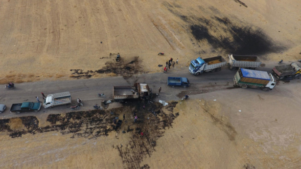An areal picture taken on Oct. 28, 2019, shows vehicles near a destroyed truck at the spot where Abu Hassan al-Muhajir, the ISIS terrorist group's spokesman, was reportedly killed in a raid in the northern Syrian village of Ayn al-Bayda near Jarablus, on the western bank of the river Euphrates on the border with Turkey. (Aref Tammawi/AFP/Getty Images)