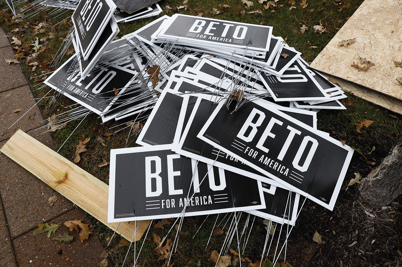 Campaign signs for Democratic presidential candidate Beto O'Rourke sit piled up before the Iowa Democratic Party's Liberty and Justice Celebration in Des Moines, Iowa, on Nov. 1, 2019. (AP Photo/Charlie Neibergall)