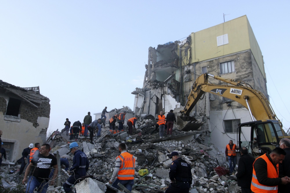 Rescuers search at a damaged building after a magnitude 6.4 earthquake in Thumane, western Albania on Nov. 26, 2019. (Hektor Pustina/AP Photo)
