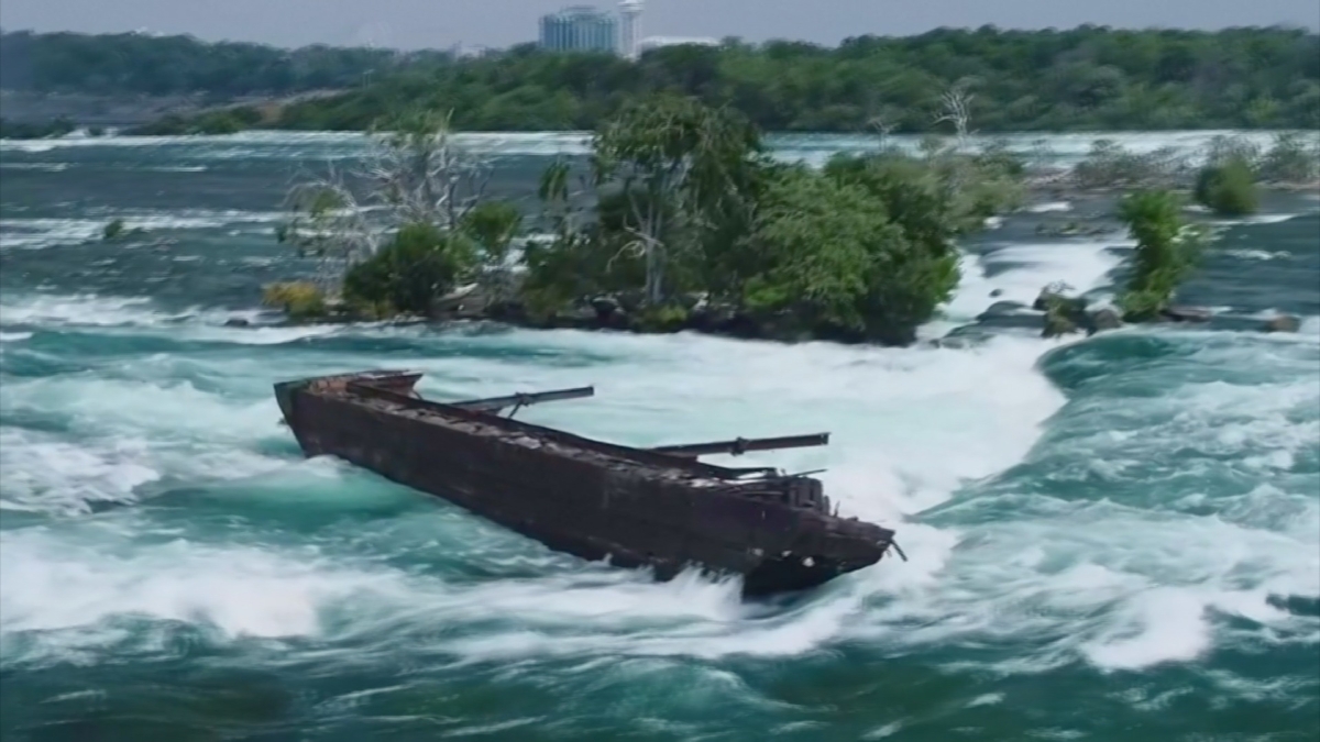 Waves crashing against the side of the "Iron Scow" ship in Niagara Falls, Ontario, Canada. (Still image from video via Reuters)