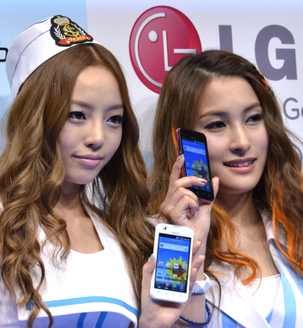 Koo Hara (L) and Park Gyuri of South Korean all-girl pop group Kara pose with the new smart phone "Optimus Bright", produced by South Korean electronics giant LG Electronics in Tokyo on June 17, 2011. (Yoshikazu Tsuno/AFP via Getty Images)
