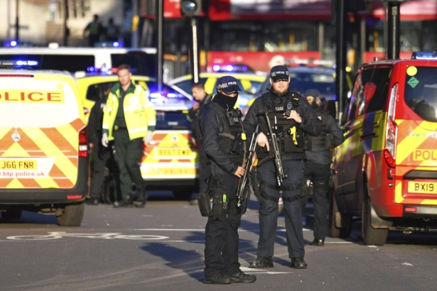 Armed police at the scene of an incident on London Bridge in central London following a police incident, on Nov. 29, 2019. (Dominic Lipinski/PA via AP)
