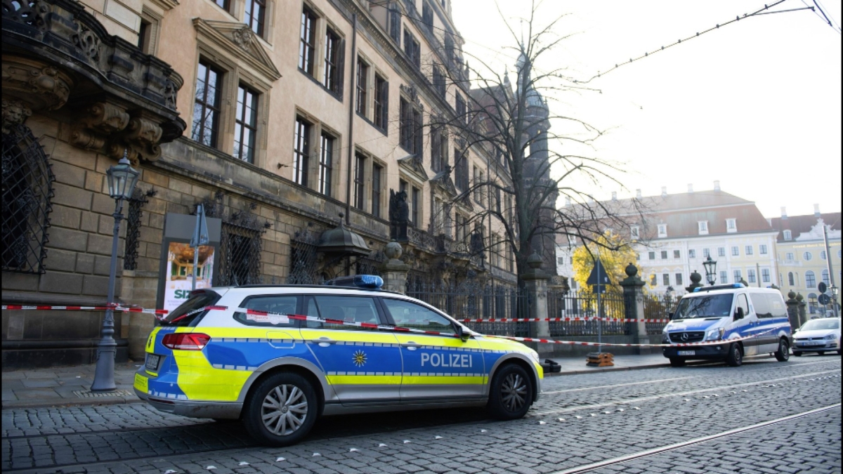Police cars stand in front of the Residenzschloss, Residence Palace, building in Dresden, Germany on Nov. 25, 2019. (Sebastian Kahnert/dpa via AP)