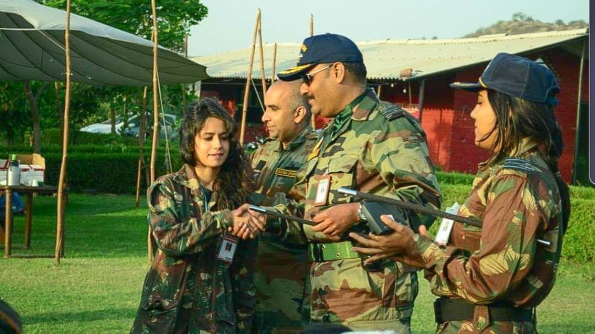 Police say they recovered photos of Mahbubani, seen in the center here wearing a cap, dressed in an army uniform. (Courtesy of Delhi Police)