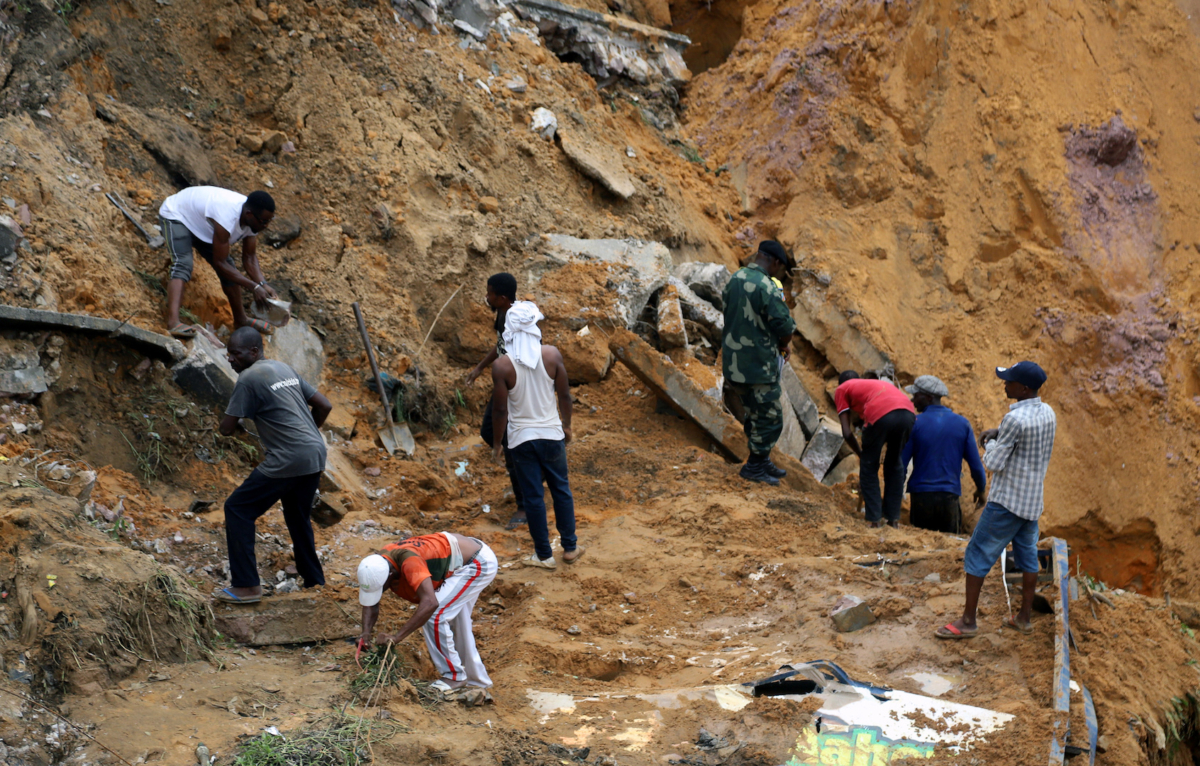 Residents search for the bodies of their missing kin at the scene of a landslide following torrential rains near the University of Kinshasa, in the Democratic Republic of Congo on Nov. 27, 2019. (Kenny Katombe/Reuters)
