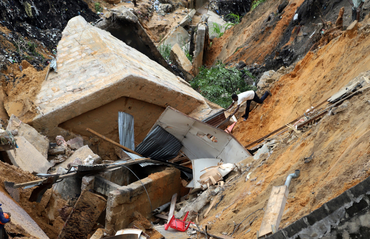 A man is seen at the scene of a landslide following torrential rains near the University of Kinshasa, in the Democratic Republic of Congo on Nov. 27, 2019. (Kenny Katombe/Reuters)