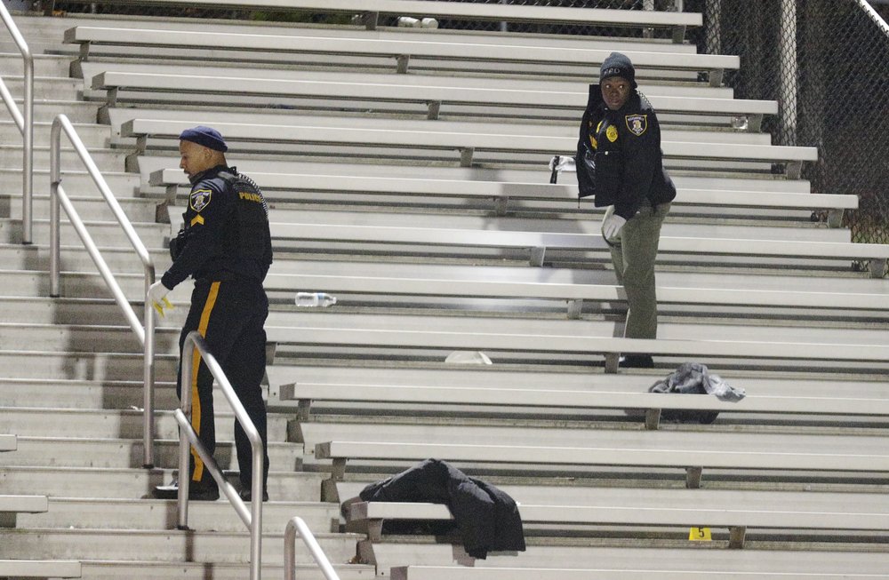 Pleasantville police search the stands after a shooting that occurred during a football game at Pleasantville High School in New Jersey, on Nov. 15, 2019. (Edward Lea/The Press of Atlantic City via AP)