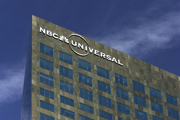 The NBC Universal logo hangs on its headquarters building in Los Angeles, Calif. in a file photograph. (David McNew/Getty Images)