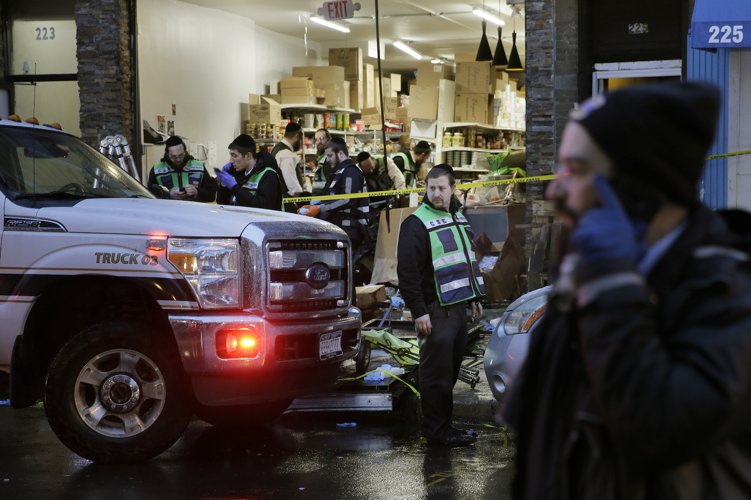 Emergency responders work at a kosher supermarket, the site of shooting in Jersey City, N.J., on Dec. 11, 2019.(Seth Wenig/AP)