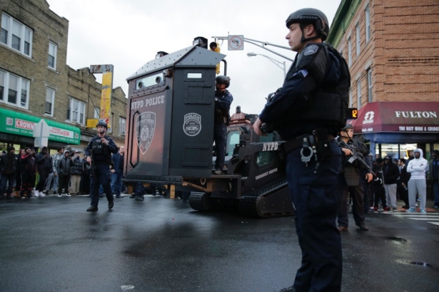 Law enforcement gathers near the scene following reports of gunfire, 