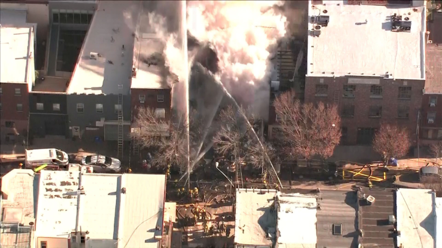 Philadelphia Firefighters Respond to Building Blaze and Collapse