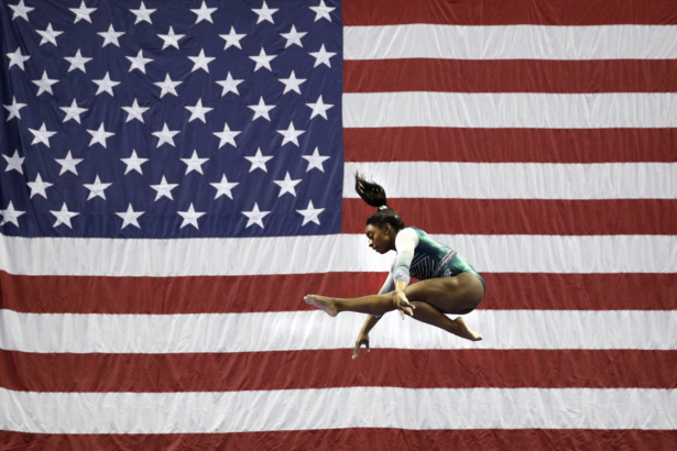 Simone Biles competing on the beam during the senior women's competition at the U.S. Gymnastics Championships, in Kansas City, Mo. on Aug. 9, 2019. (Charlie Riedel/AP-File)