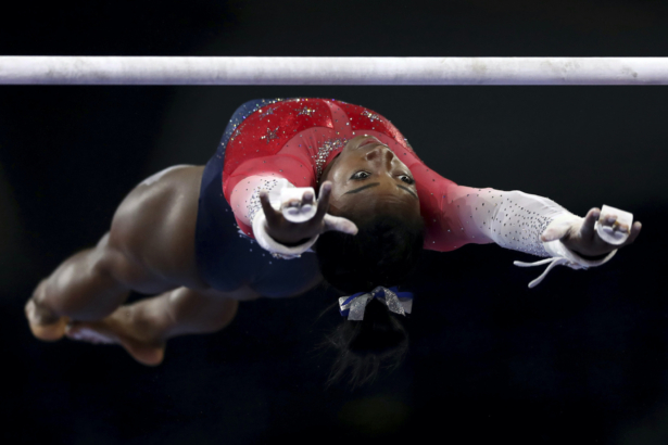 Simone Biles of the U.S. warming up on the uneven bars during women's team final at the Gymnastics World Championships in Stuttgart, Germany on Oct. 8, 2019. (Matthias Schrader/AP-File)