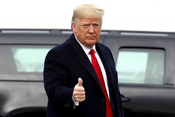 President Donald Trump makes the thumbs-up sign as he exits a motorcade to board Air Force One at Andrews Air Force Base, Md., en route to Philadelphia to attend the Army-Navy football game on Dec. 14, 2019. (Jacquelyn Martin/AP Photo)