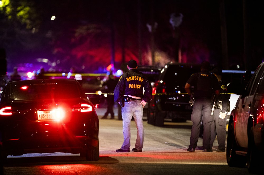 Houston Police Department officers stand by the scene of a shooting in Houston on Dec. 7, 2019. (Marie D. De Jesus/Houston Chronicle via AP)