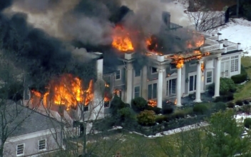 Flames Consume Mansion as Crews Struggle to Get Water on It