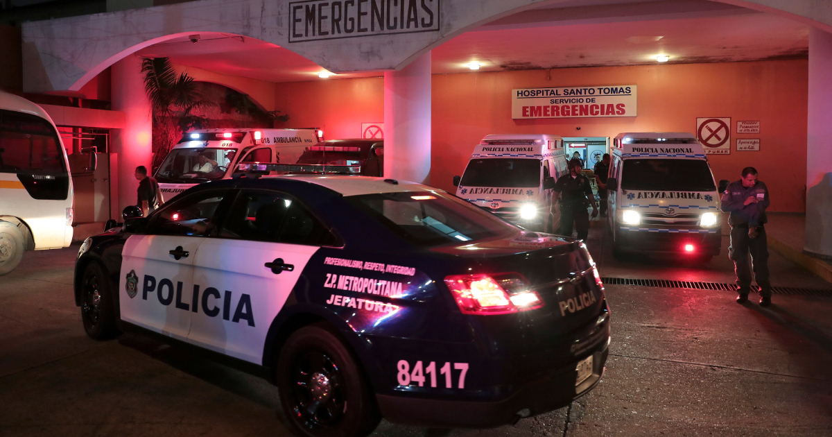 A police patrol car is seen outside a hospital where injured inmates were taken following a shootout among inmates at La Joyita prison, in Panama City, Panama Dec. 17, 2019. (Reuters/Erick Marciscano)
