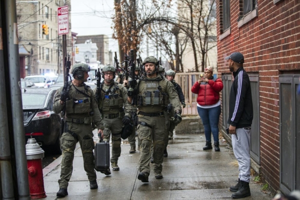 Police officers arrive at the scene following reports of gunfire, in Jersey City, N.J., on Dec. 10, 2019. (Eduardo Munoz Alvarez/AP Photo)