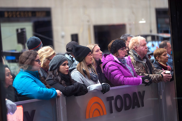 Fans watch outside of the set of NBC's Today Show in New York City on Nov. 29, 2017. (Drew Angerer/Getty Images)