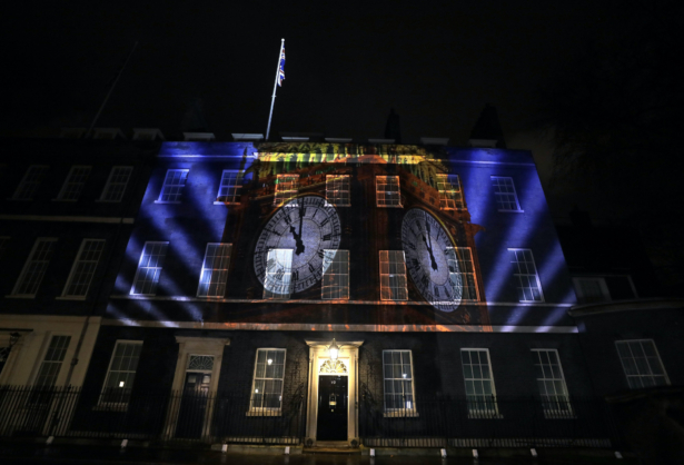 An image of the clock face of 'Big Ben' is projected onto the exterior of 10 Downing street, the residence of the British Prime Minister, in London as Britain left the European Union on Jan. 31, 2020. (Kirsty Wigglesworth/AP Photo)