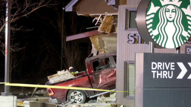 Personnel work at the scene in McHenry, Ill. where a vehicle drove into the Starbucks, on Jan. 16, 2020. (Patrick Kunzer/Daily Herald via AP)